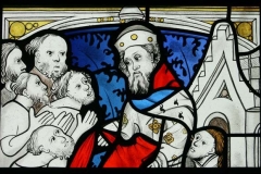 Corporal Acts of Mercy painted stained glass panel